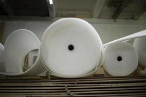 Boards and thin parallon. Parallon roll in stock. White material. photo