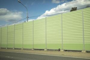 Fencing on highway. Details of route outside city. photo