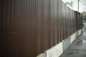 Steel fence in detail. Fence made of metal profile. Durable material to protect against prying eyes. photo