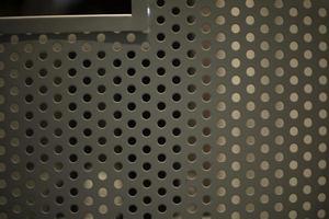 Metal texture with holes. Steel profile with holes. Interior details. photo