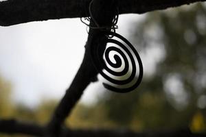 Insect spiral. Mosquito repellent. Round object on background of nature. Hiking details. photo