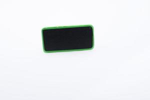 Small green sided black noticeboard on white background photo