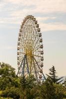 Ferris wheel in an amusement park in  green region photo