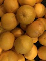 fresh orange fruits as background, top view photo