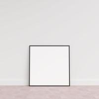 Empty picture frame on wooden floor leaning against wall. Blank poster frame standing on wooden floor. Blank poster frame mockup. Empty picture frame mockup. 3d rendering. photo