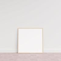 Empty picture frame on wooden floor leaning against wall. Blank poster frame standing on wooden floor. Blank poster frame mockup. Empty picture frame mockup. 3d rendering. photo