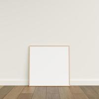 Empty picture frame on wooden floor leaning against wall. Blank poster frame standing on wooden floor. Blank poster frame mockup. Empty picture frame mockup. 3d rendering. photo