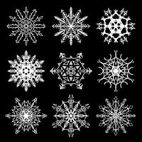 Set of nine beautiful drawn snowflake silhouettes vector