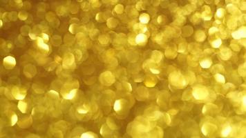 Abstract golden texture in blurry light for background animation. Glitter pattern for video effect, transition and overlay