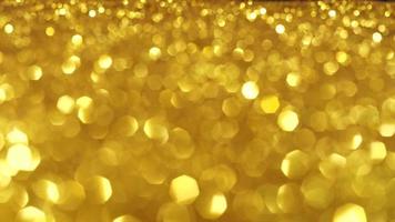 Abstract golden texture in blurry light for background animation. Glitter pattern for video effect, transition and overlay