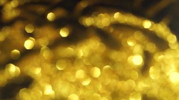 Abstract golden texture in blurry light for background animation. Glitter pattern for video effect, transition and overlay