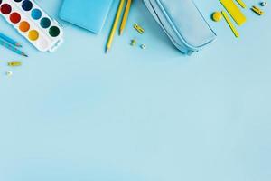 School Desk with scattered writing materials. photo