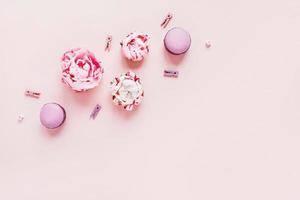 Greeting card with peonies and macaroons. photo