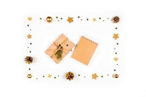 Christmas card. Festive background with pine cones, branches, gold toys. photo