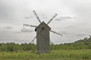 Wooden old mill. Medieval mill. Wooden building photo