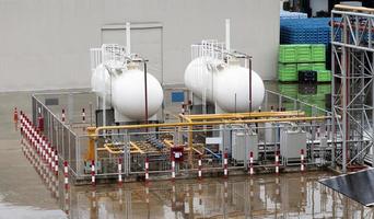 Two white fuel oil tanks are used for industrial plants. photo