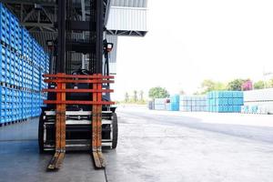 Forklift trucks parked in a warehouse. photo