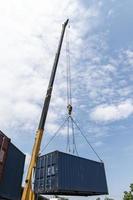 Crane lifting up container loading photo