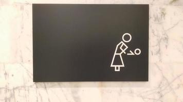 Unique sign of nursery room at the wall, usually at the mall or public area. photo