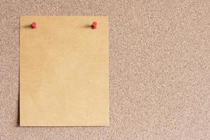 Blank paper note with pin on board. With copy space for ideas, reminders, appointments, to-do lists, messages. photo