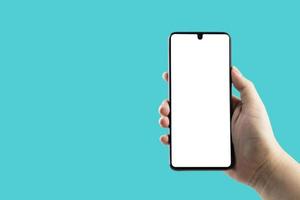 Hand holding a black smartphone with a white screen. with copy space. Designing a frameless smartphone application photo