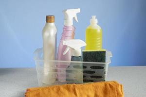 basket with cleaning products for home hygiene use photo