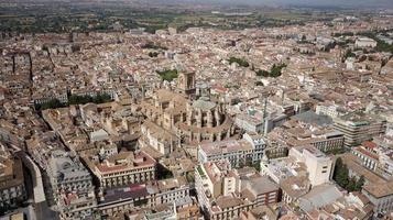 Aerial drone view of Granada Cathedral. Panoramic view of the city of Granada in Spain. Old and multicultural town. Heritage Spain. Cityscape photo