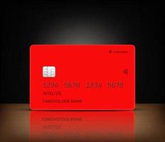 Red banking card with reflection on a table. 3d vector mockup