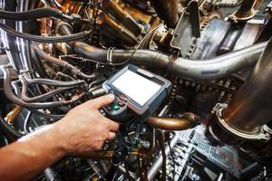 Inspection of a gas turbine engine using a Video Endoscope. Search for defects inside the turbine and shooting on video, photos using a measuring instrument.