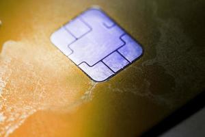 Electronic contactless credit card with selective focus microchip. Macro of a credit card. photo