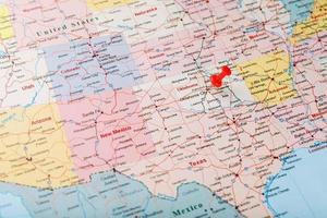 Red clerical needle on a map of the USA, Oklahoma and the Capital of Oklahoma City. Close up map of Oklahoma with red tack photo