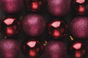 Purple Christmas balls close up as background. Full screen, photo