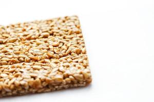 Healthy snacks. Fitness diet food. Kozinaki fritter, seeds, energy bars. White background top view. Isolate, Copy Space photo