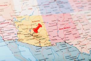 Red clerical needle on a map of the USA, Arizona and the capital Phoenix. Close up map of orizona with red tack photo