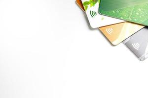 Credit cards with contactless payment. Pile of credit cards on white isolated background photo