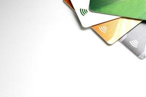 Credit cards with contactless payment. Pile of credit cards on white isolated background photo