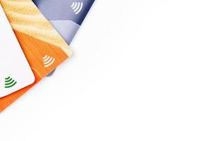 Credit cards with contactless payment. Pile of credit cards on white isolated background photo