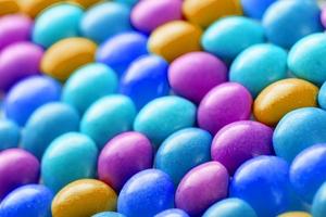 Texture-background of multicolored candies. Colors of the rainbow close-up, texture and repeating of the dragee photo