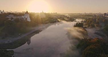 morning river with mist and fog overlooking old medieval castle video