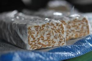 Sliced tempeh, a healthy vegan food alternative, made from soybeans. photo