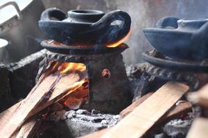 a furnace for making pancakes, made of clay and has a unique and small shape photo