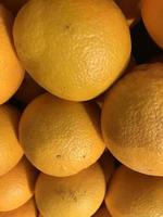 fresh orange fruits as background, top view photo