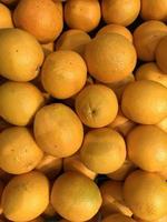 fresh orange fruits as background, top view photo