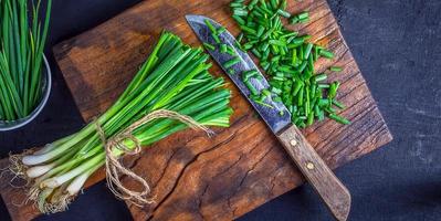 Fresh onion cut on wooden chopping board photo