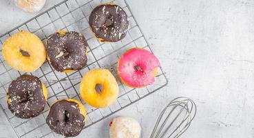 Donuts on a white wood background photo