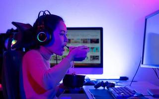 A young and serious gamer who enjoys playing online video games. To the point where he had to eat instant noodles in front of his powerful computer. photo