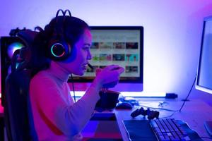 A young and serious gamer who enjoys playing online video games. To the point where he had to eat instant noodles in front of his powerful computer. photo