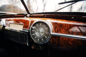 Vintage car brown marble dashboard with retro gauges photo