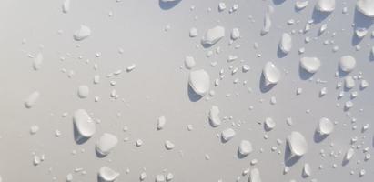 Water droplets perspective through white color surface photo