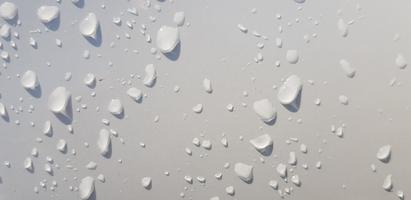 Water droplets perspective through white color surface photo